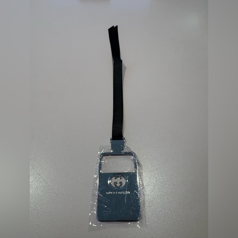 Gucci Guilty Bookmark or Nag Charm with ribbon and metal GG logo.